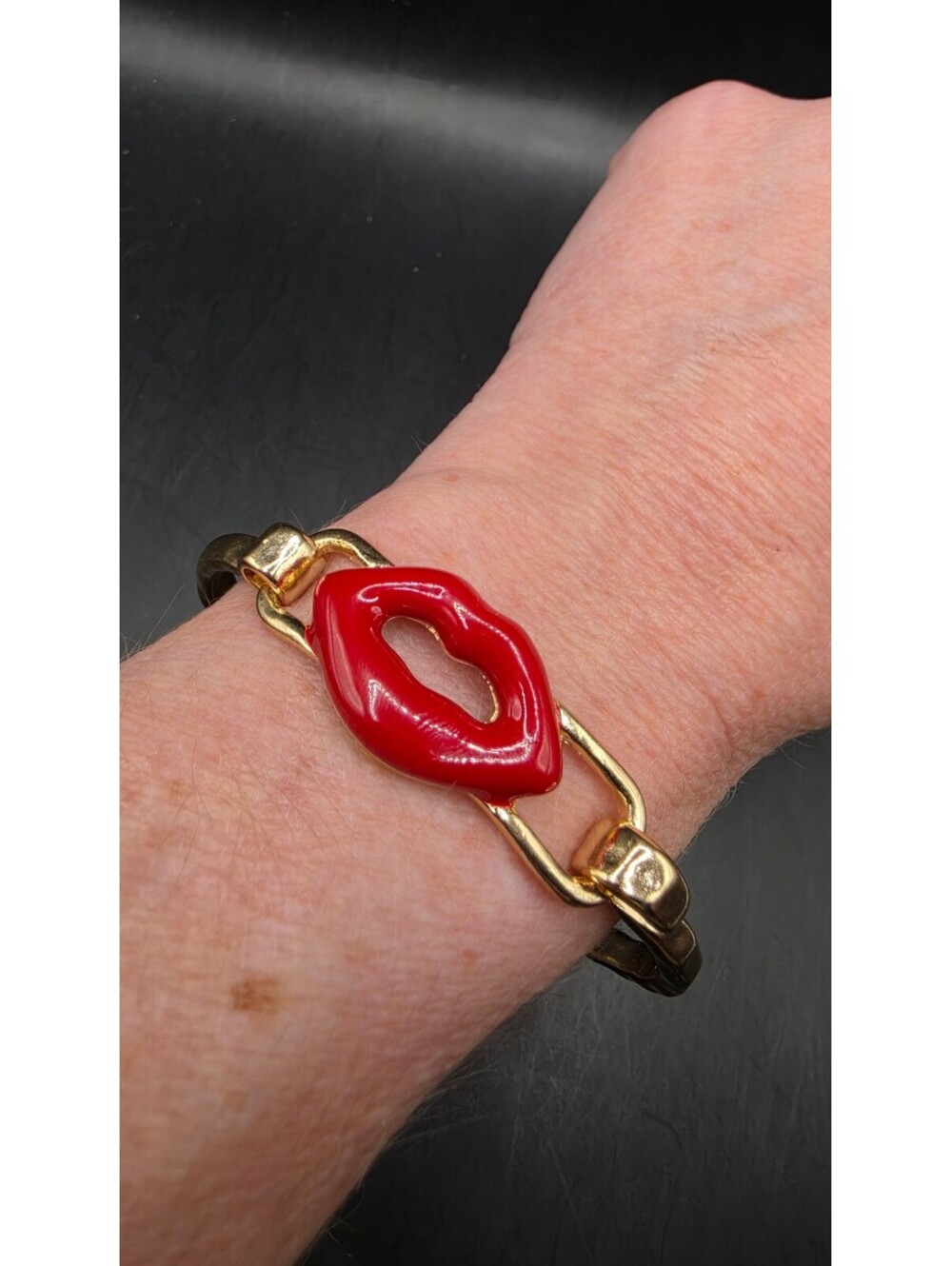 Gold Tone Spring Bracelet with Red Lips Accent